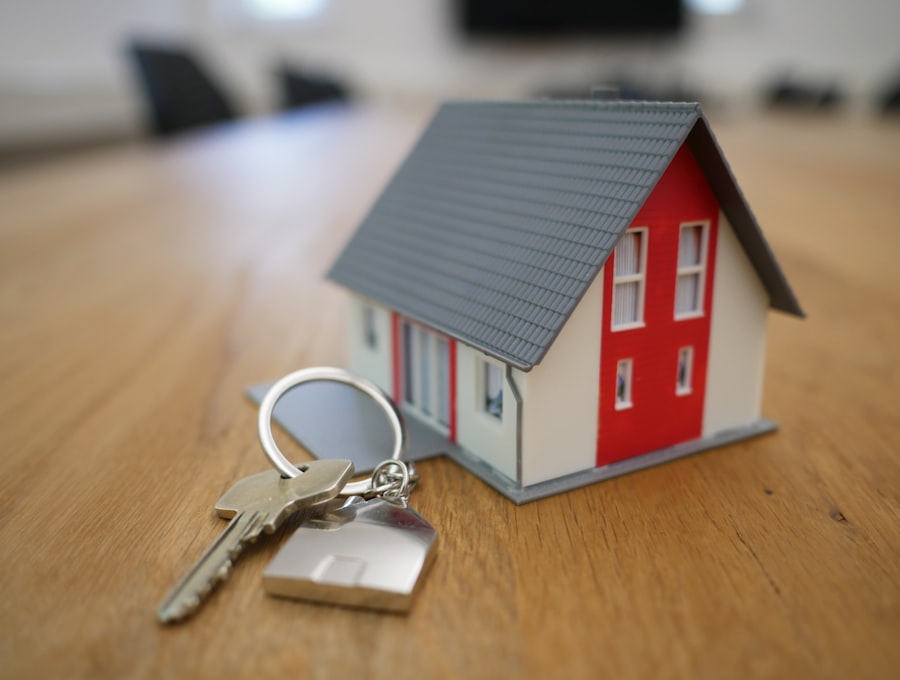 Estate agent handing keys to a buyer outside a house